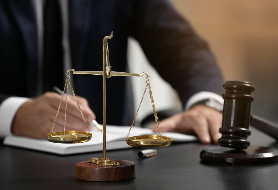 Scales Of Justice On A Table — Criminal Law Firm In Brisbane, QLD