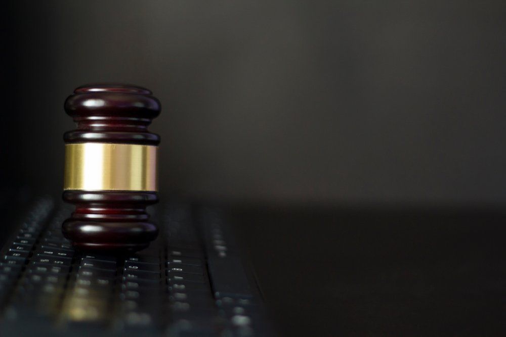 Judge's Gavel On Computer Keyboard — Criminal Law Firm In Brisbane, QLD