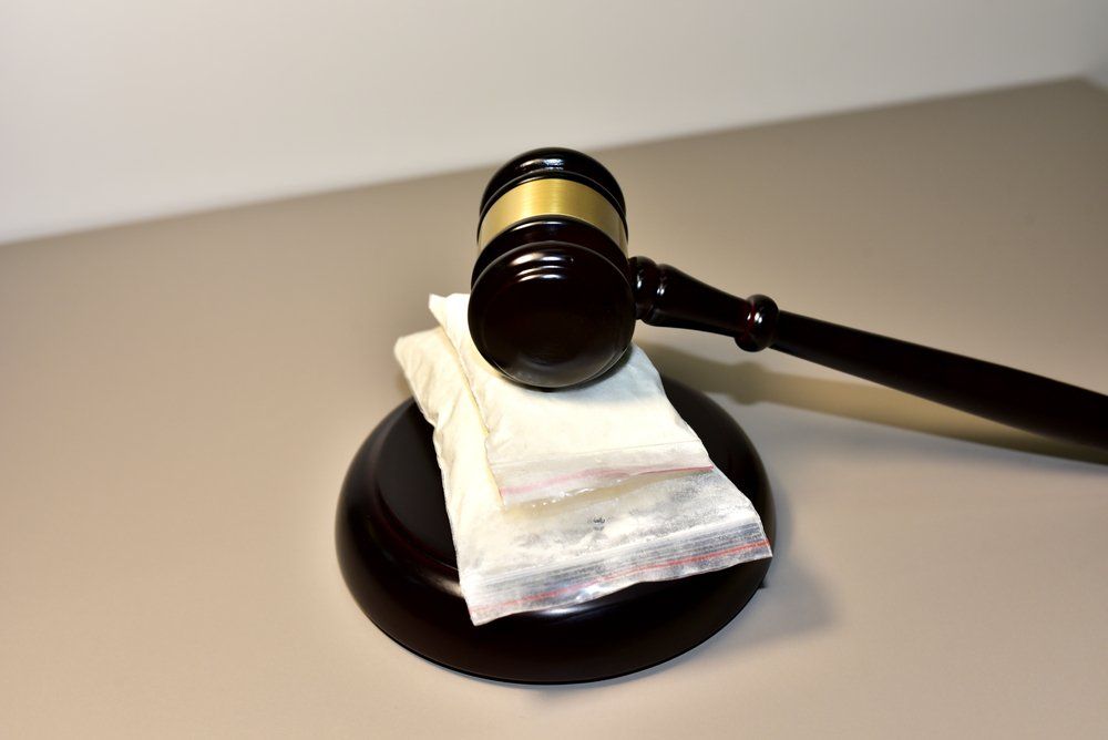Bags Of Drugs Under A Judge's Gavel — Criminal Law Firm In Brisbane, QLD