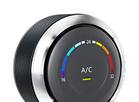 A black, circular digital thermostat dial with a metallic trim, displaying 