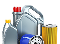 Two gray motor oil bottles with red and yellow caps, a blue oil filter, and a yellow cylindrical oil filter component. | Waggener Brake and Auto Repair