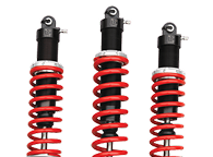 Three identical shock absorbers with bright red coiled springs and black mounting hardware against a white background. | Waggener Brake and Auto Repair
