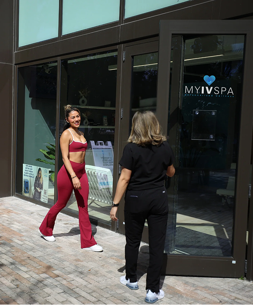 Woman in red activewear exits