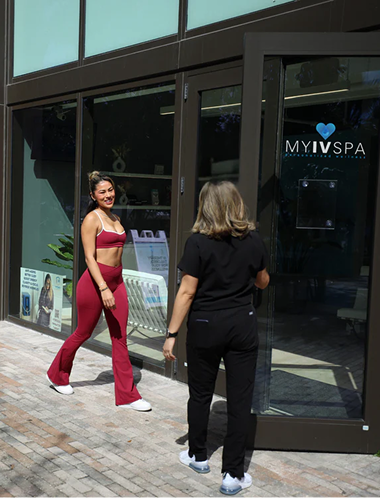Woman in red activewear exits