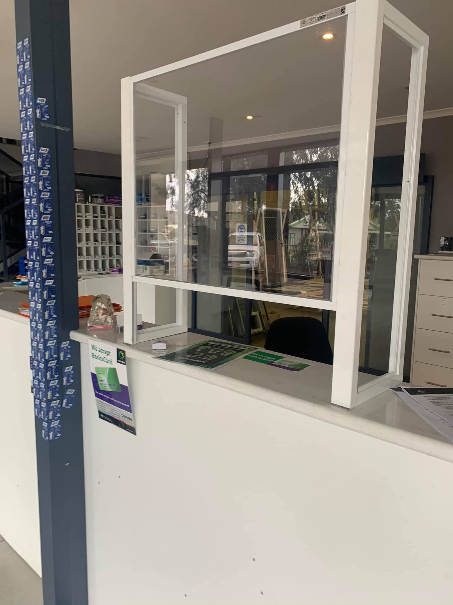 A White Counter With A Clear Glass Divider On It — GGS Alice Glass & Aluminium In Ciccone, NT