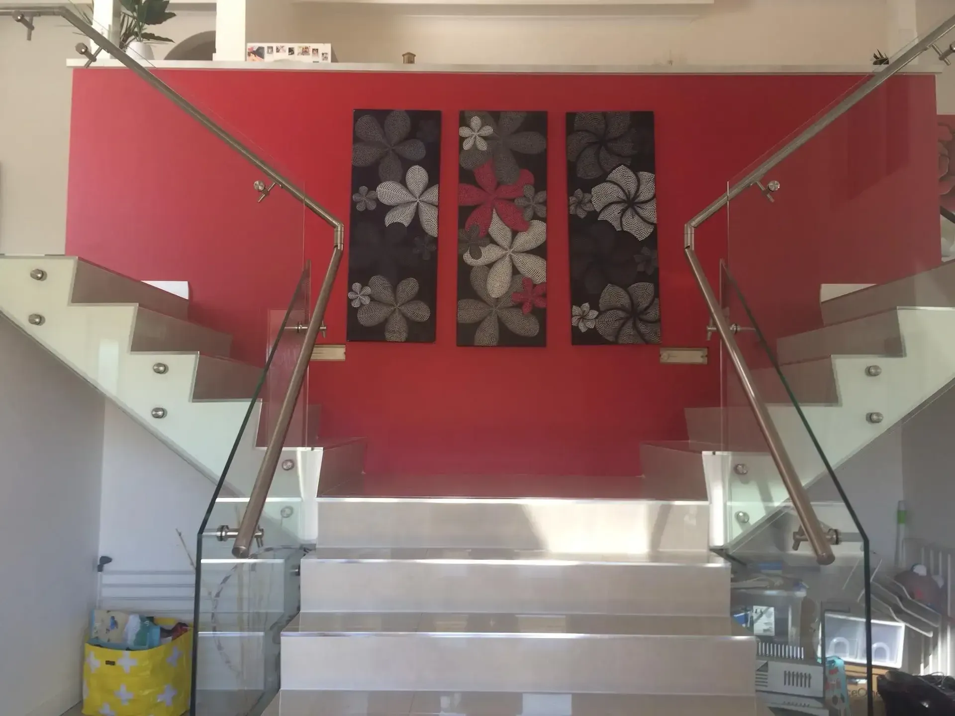 A Staircase With A Glass Railing And A Red Wall — GGS Alice Glass & Aluminium In Ciccone, NT