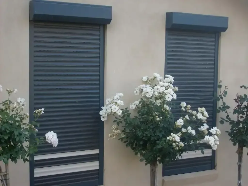 Two Windows With Shutters On Them And Flowers In Front Of Them — GGS Alice Glass & Aluminium In Ciccone, NT