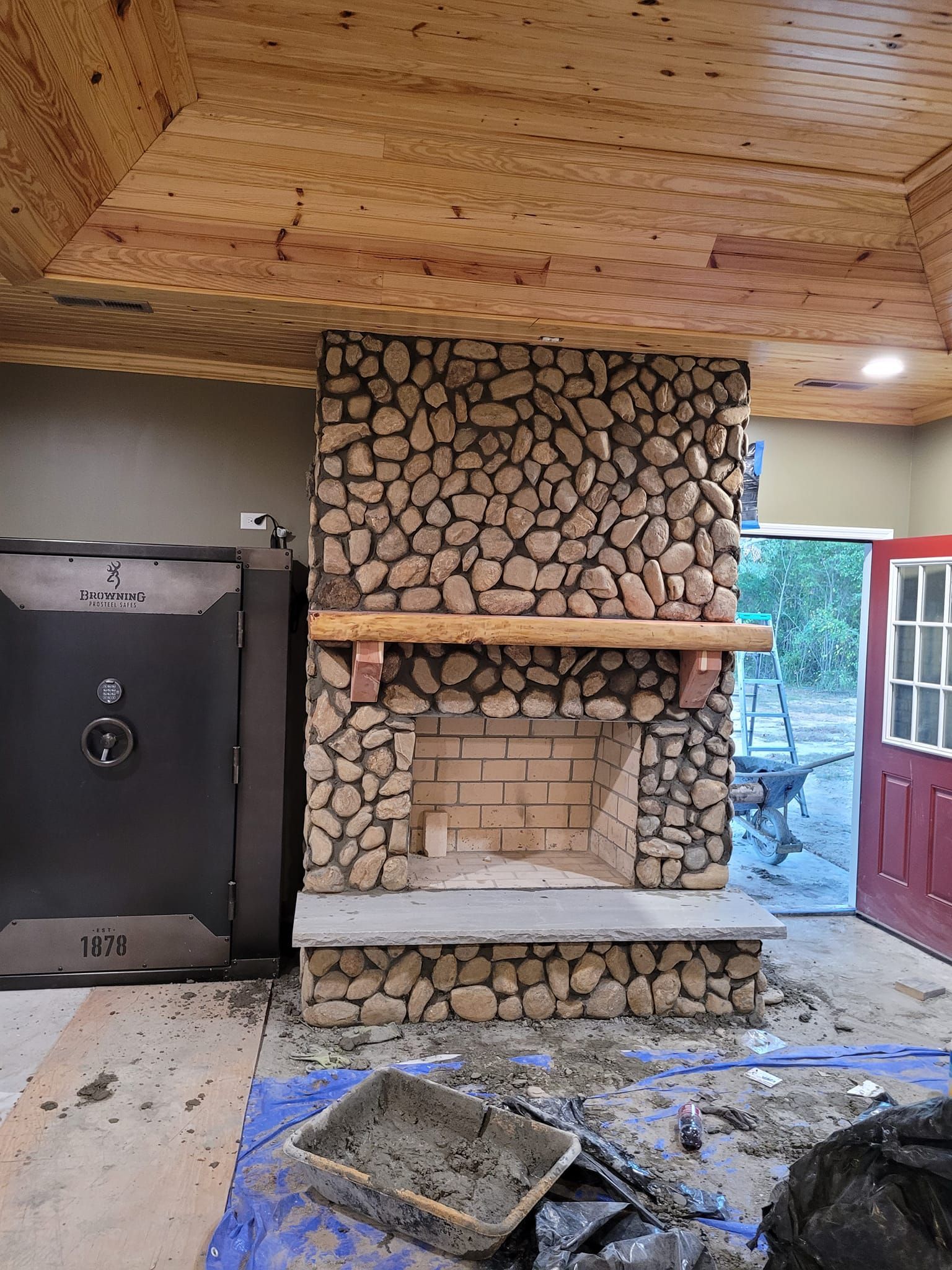 A Room With a Fireplace and a Safe in It.