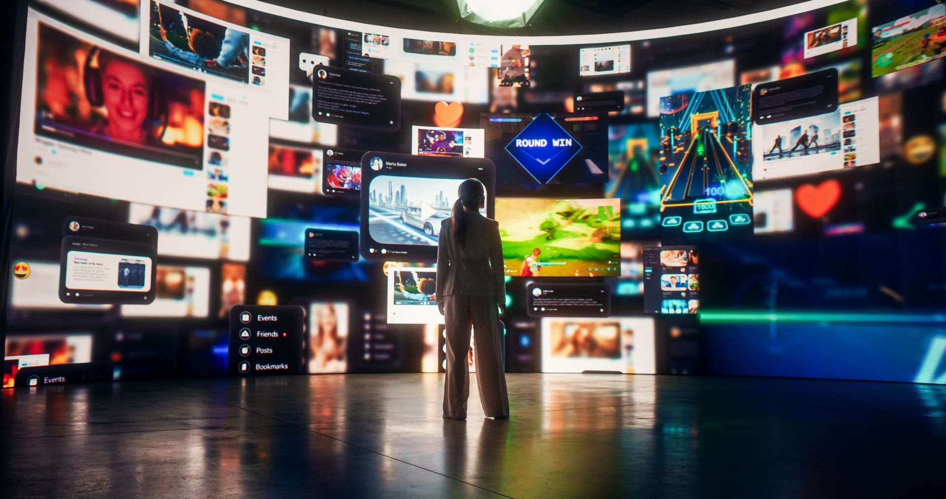 A man in a space suit is standing in front of a large screen.