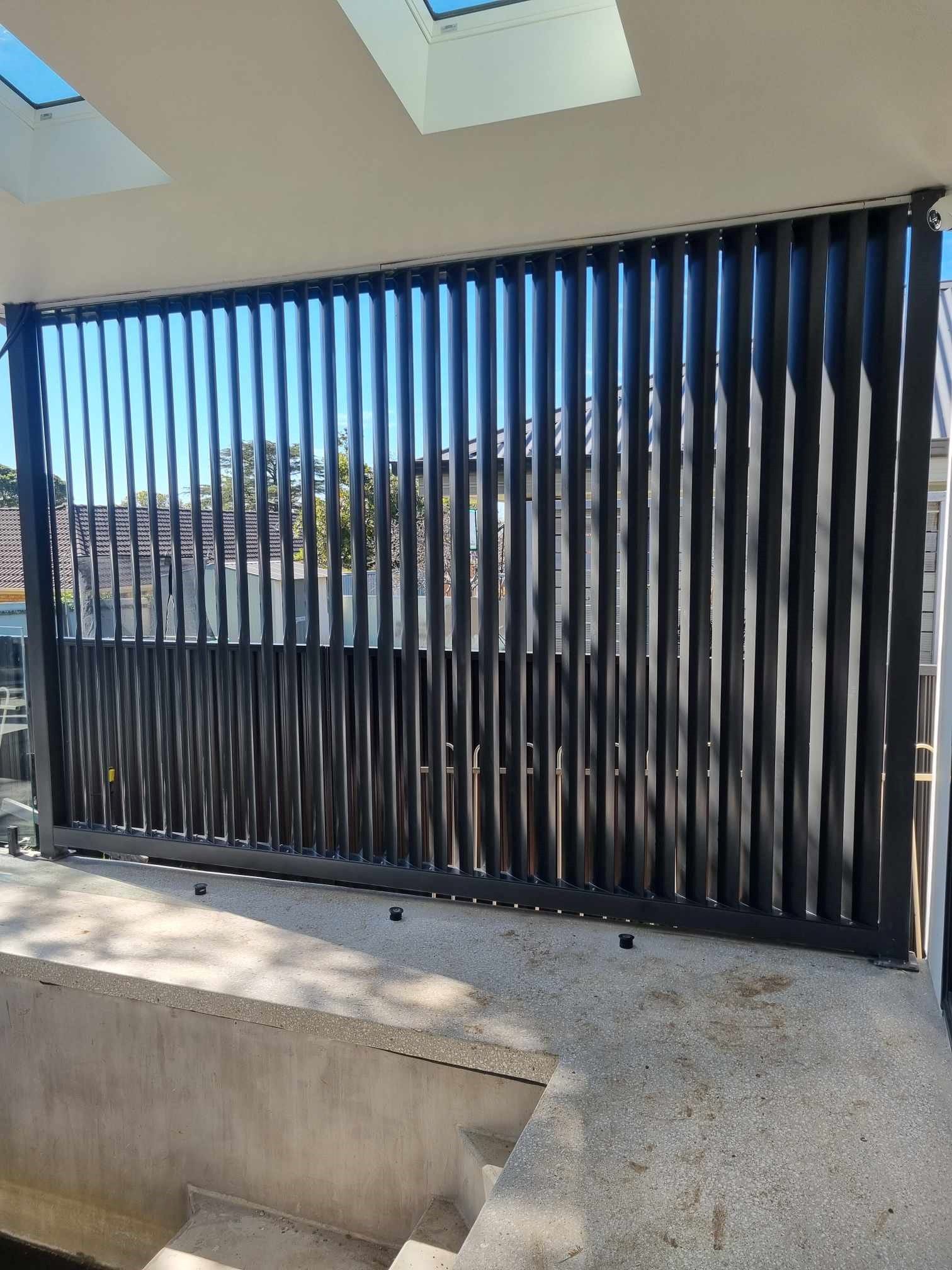 Black vertical slatted fence — D & T Balustrade Systems In Unanderra, NSW