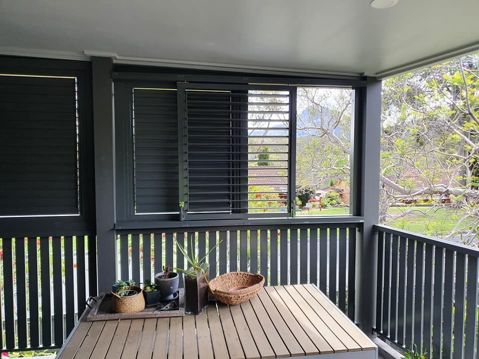 A Wooden Deck With a Fence in the Background — D & T Balustrade Systems In Kiama, NSW