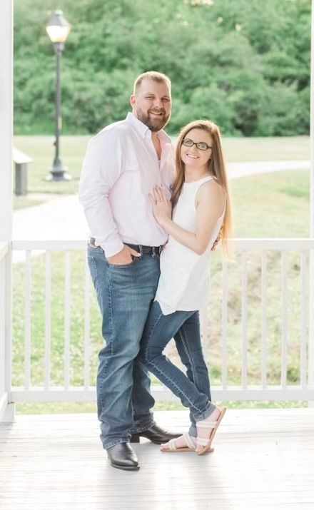 Jessica Rinker, FNP-C, MSN posing with her husband outdoors