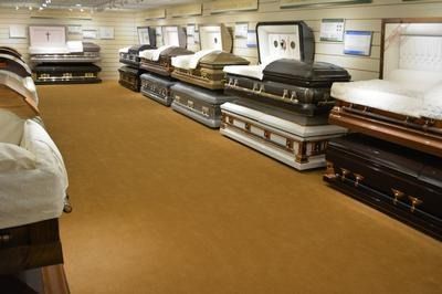 A church with rows of wooden benches and a podium