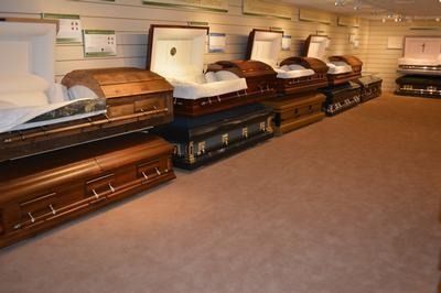 There is a coffin in the middle of the living room.