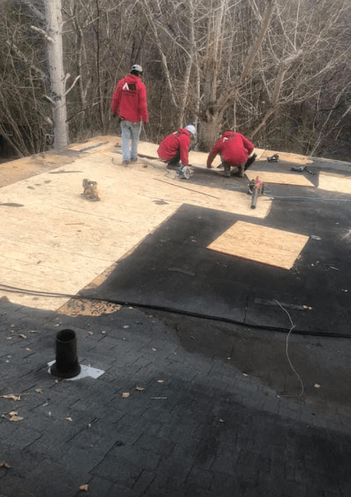 men working on roof