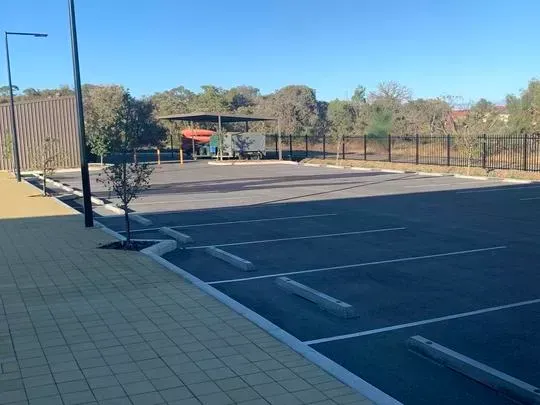 Secure asphalt parking lot.