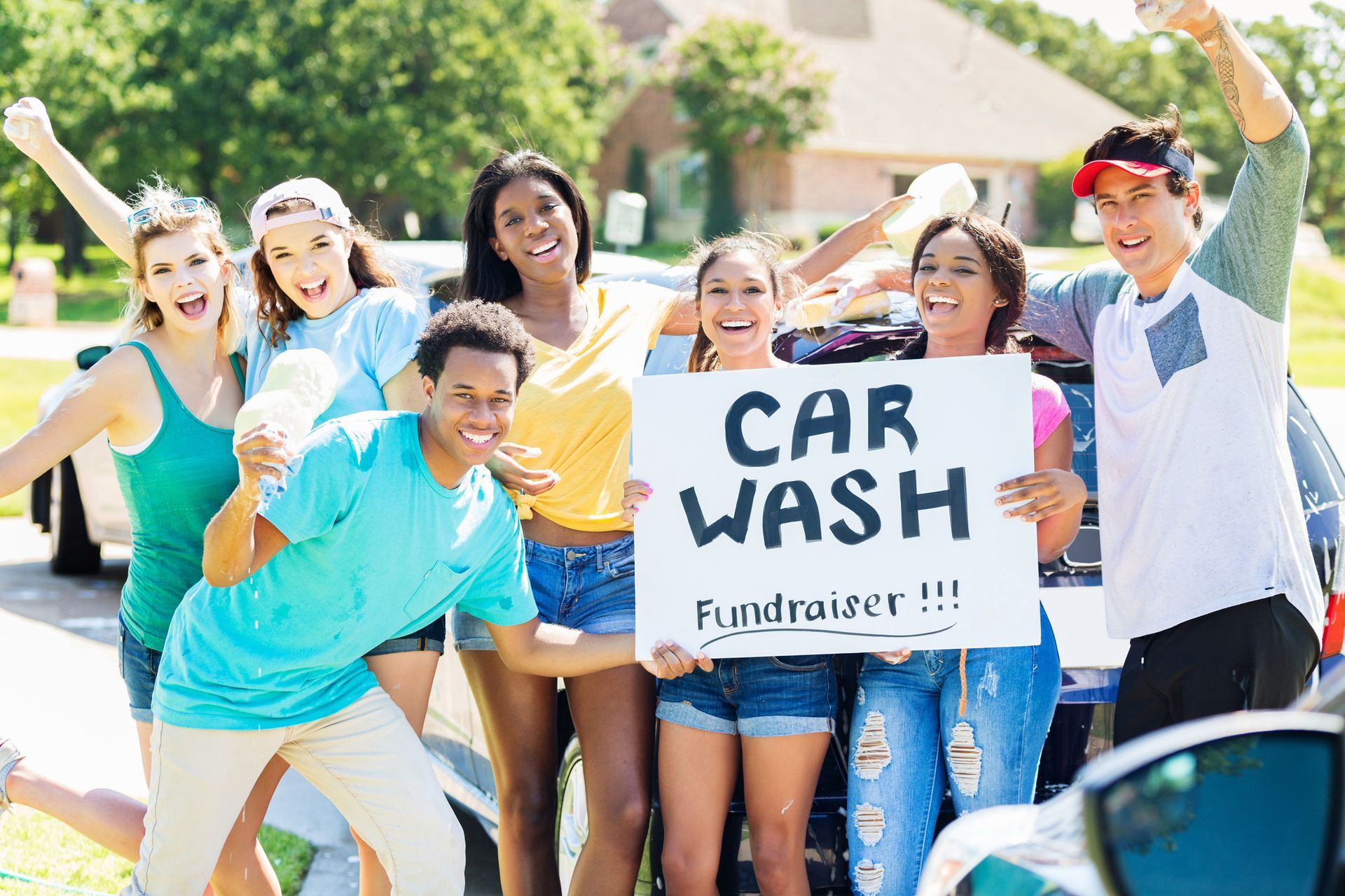 Group of young people holding a 