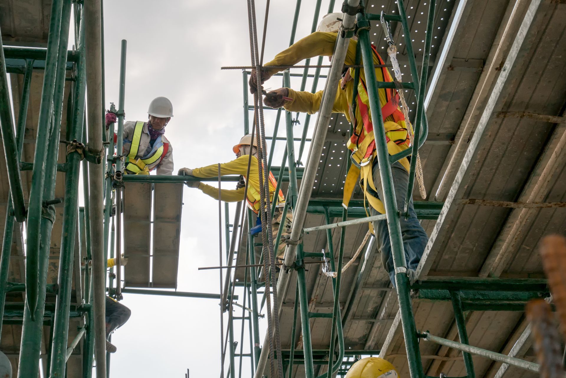 construction workers fixing a scaffold