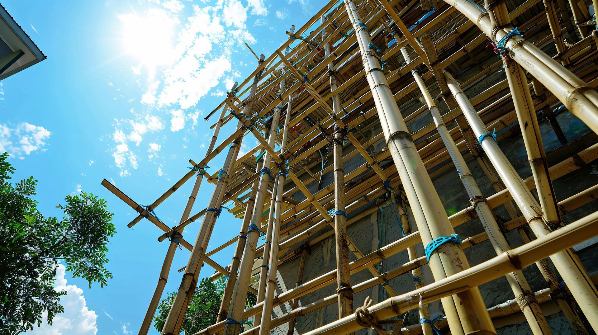 A building is being built with bamboo scaffolding.