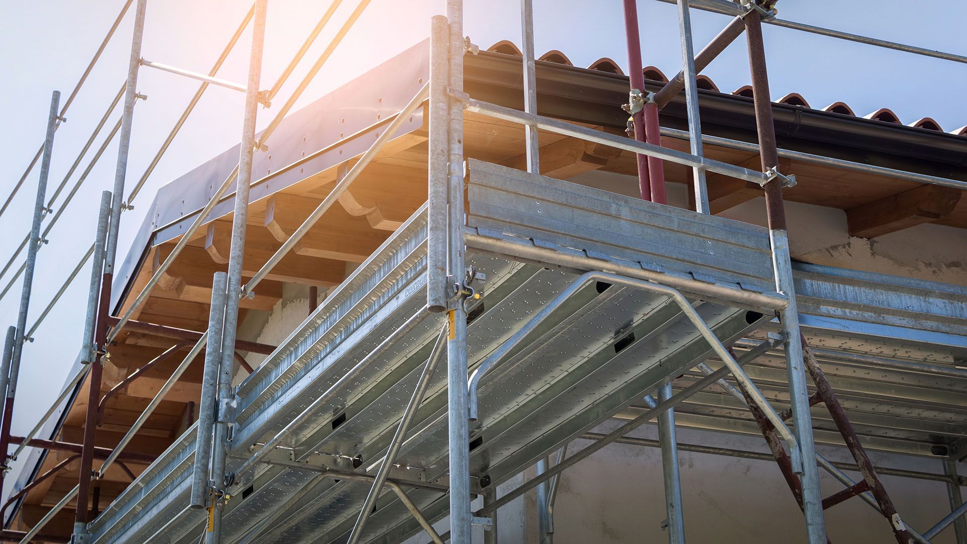 A building under construction with scaffolding on the side of it.