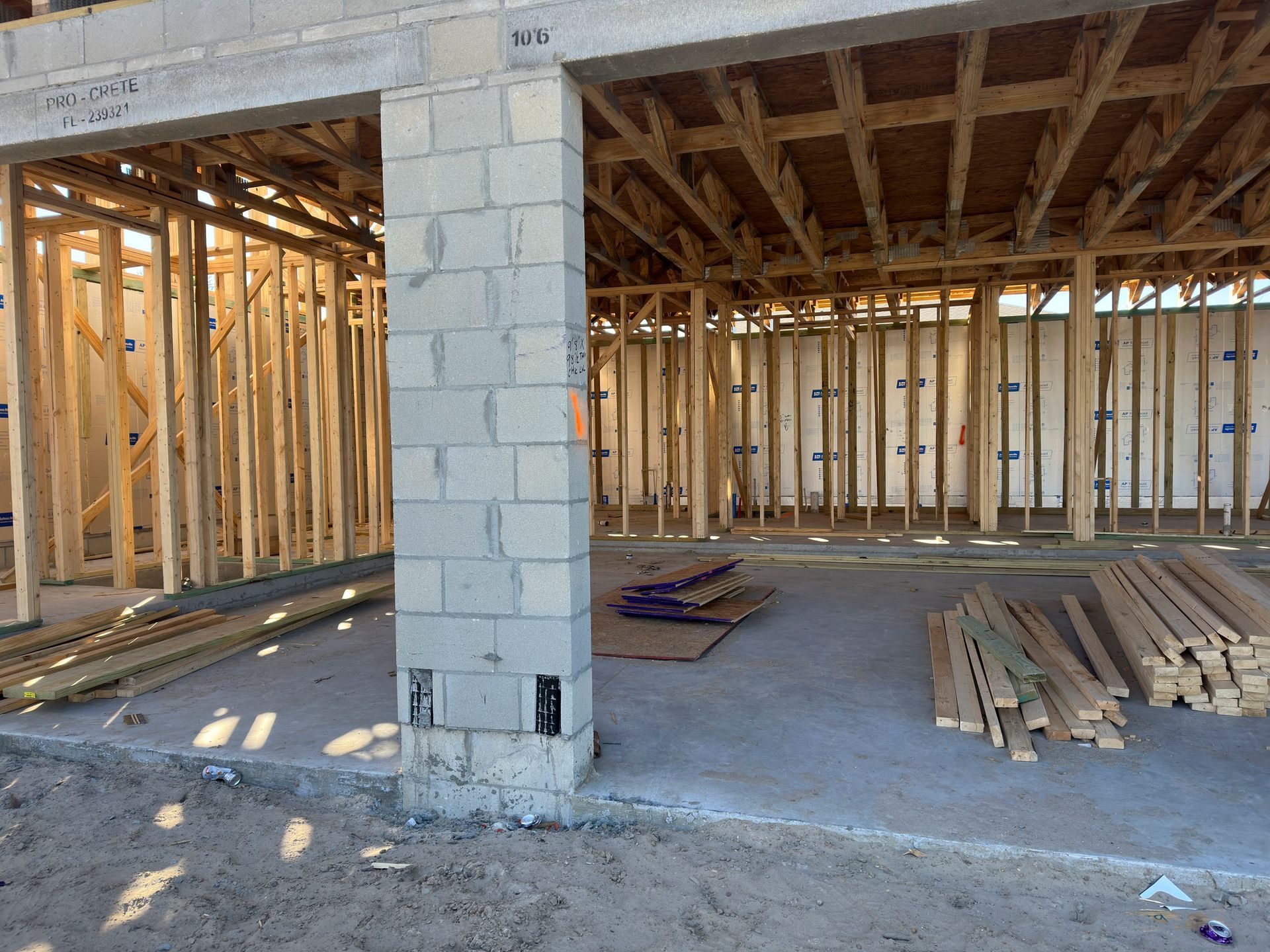 The inside of a building under construction with bricks and wood