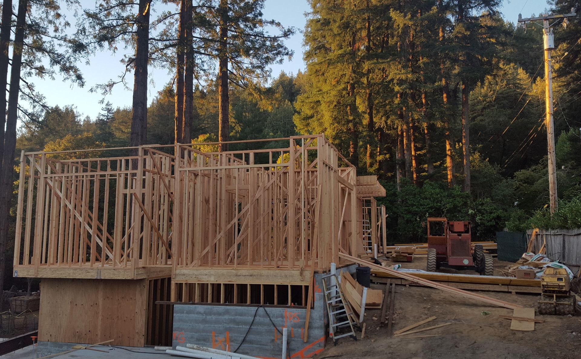 A house is being built in the middle of a forest.