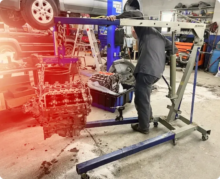 Engine lifted out of vehicle | KC Auto Solutions