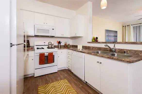 photo of a kitchen with marble-like countertop