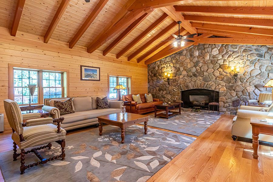 A living room filled with furniture and a fireplace.