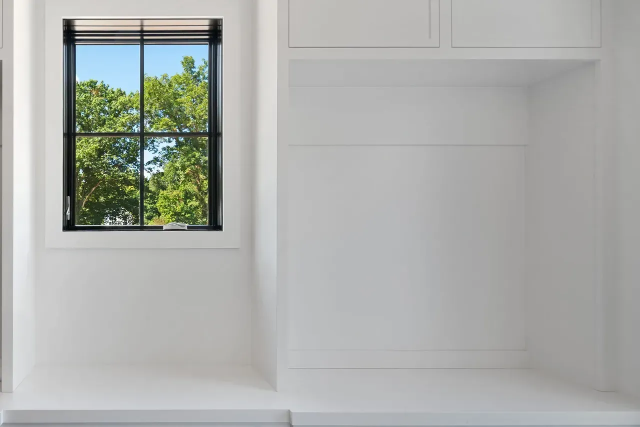 There is a window in the corner of the room.