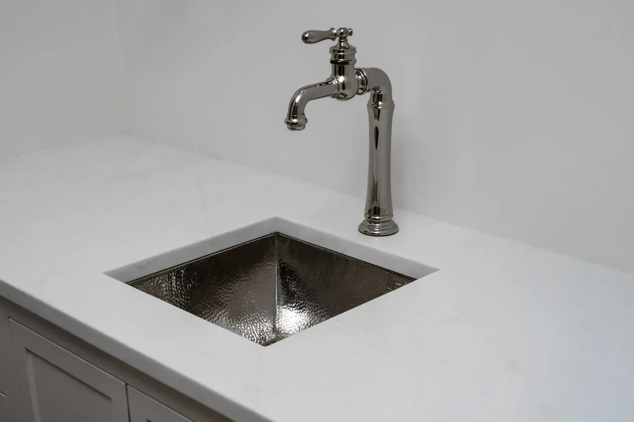 A sink with a faucet on top of it