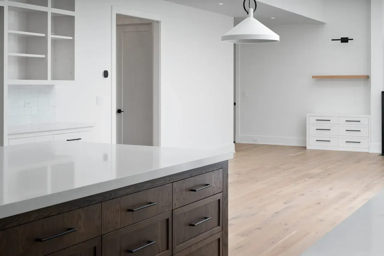 A kitchen with a large island in the middle of the room.