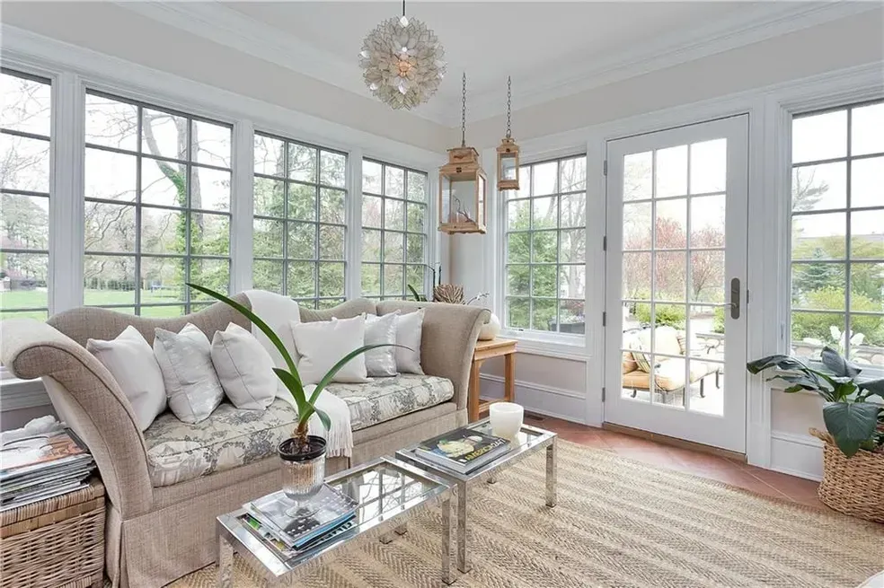 A living room with a couch and two coffee tables