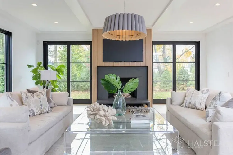 A living room filled with furniture and a fireplace.