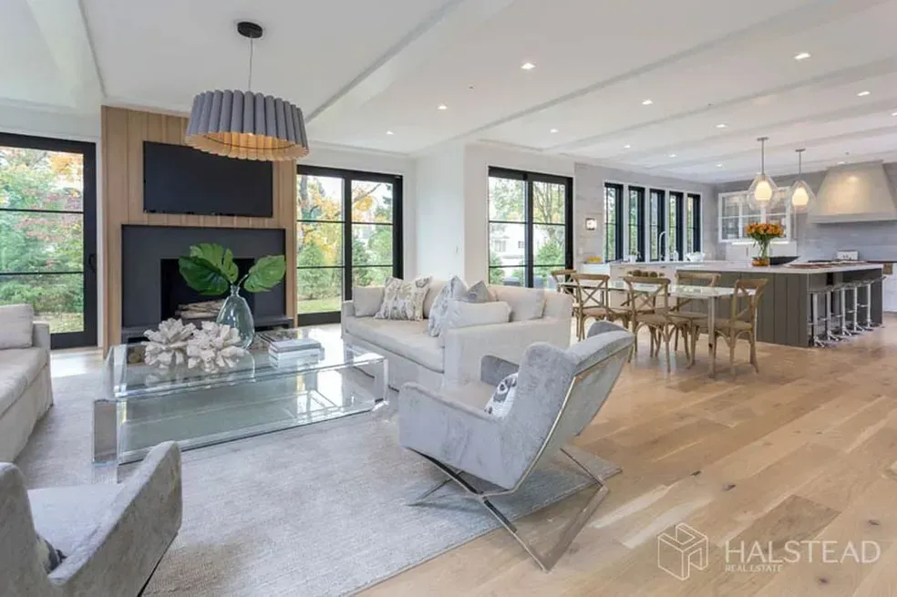 A living room filled with furniture and a fireplace.