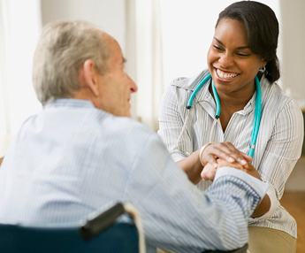 lady doctor treating old man