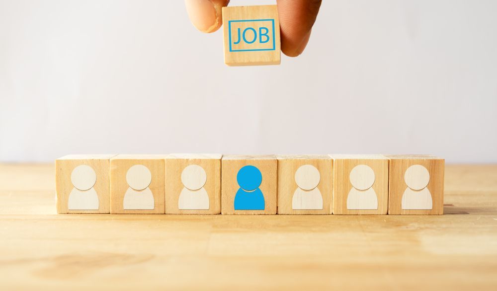 blocks on a desk to illustrate fair chance hiring for employers