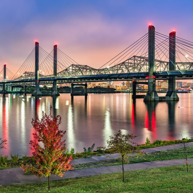 California State Capitol building with a large dome, columns, and flag, in Sacramento.