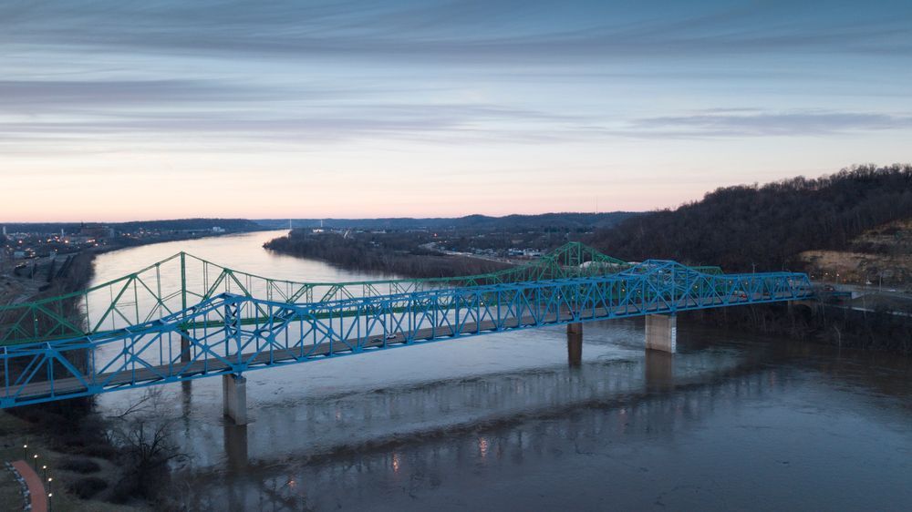 Two bridges between Ashland, KY and Ohio 52. The Ben Williamson Memorial Bridge (painted green) and the parallel Simeon Willis Bridge (painted blue).