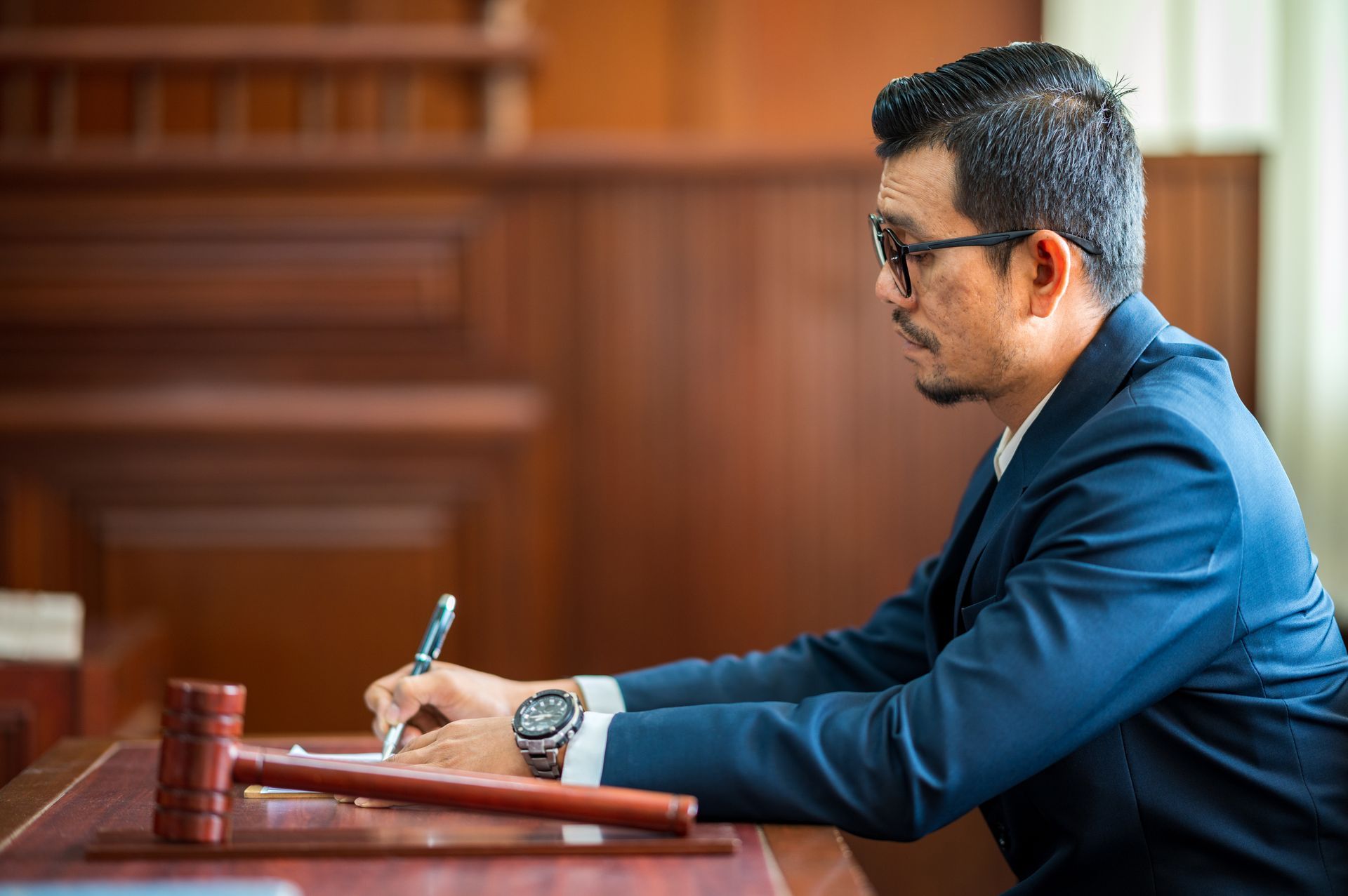 a lawyer in a court room reviewing how clean slate laws impact background checks