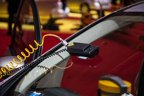 ADAS windshield calibration sensor device on a car.