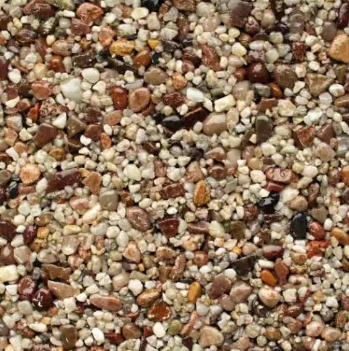 Close-up of small, smooth pebbles in shades of brown, tan, and gray.