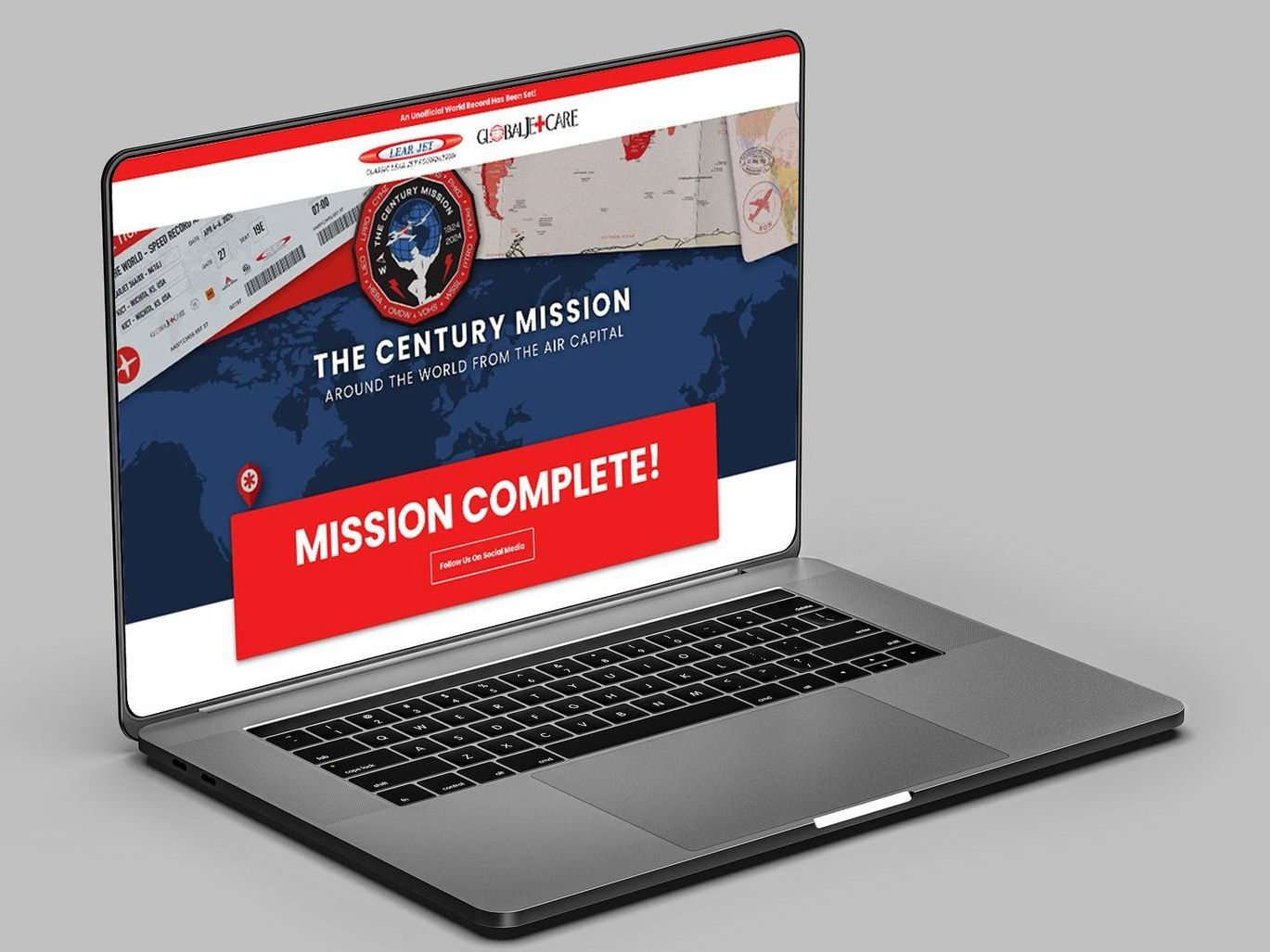 A laptop computer is open to a page that says mission complete.