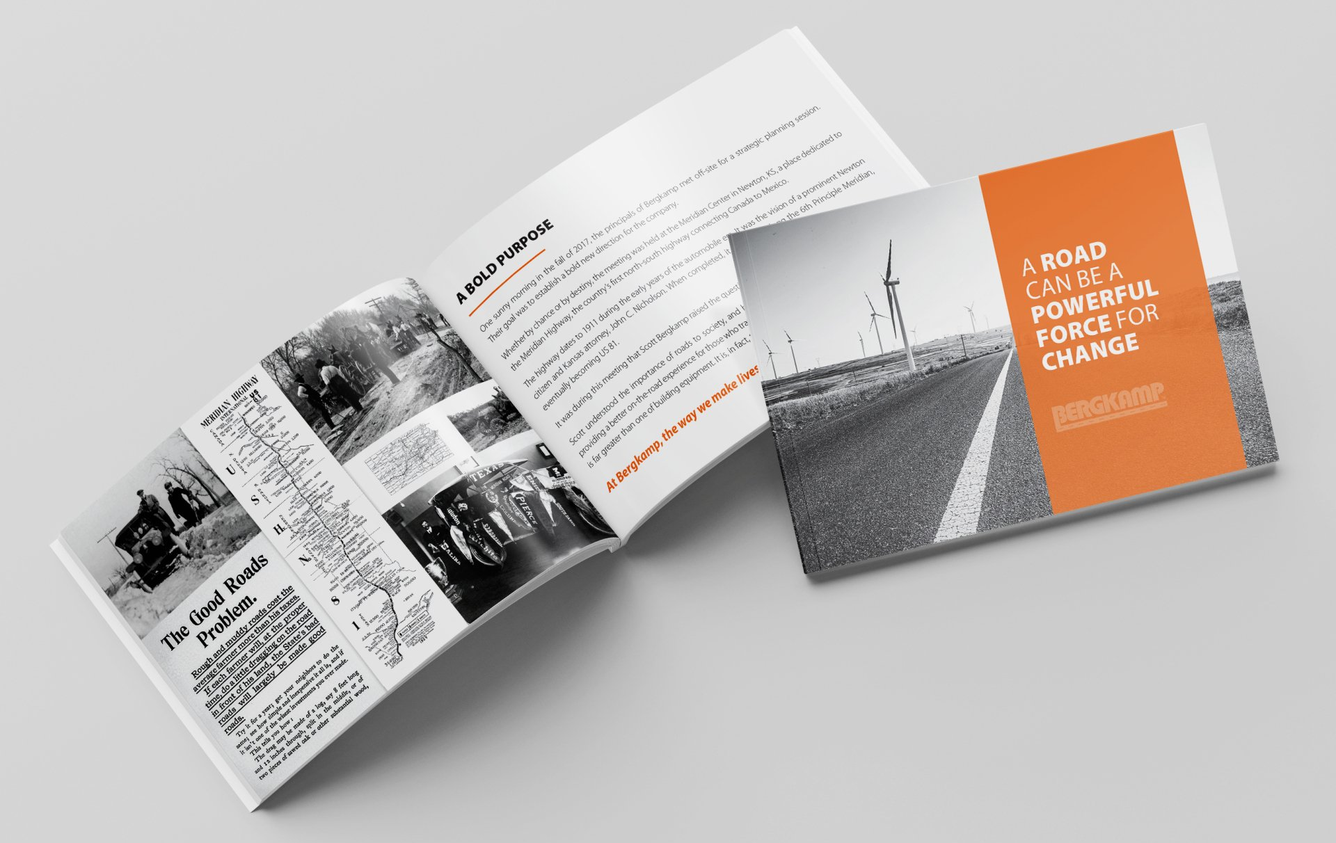 A book is open to a page with a picture of a road.