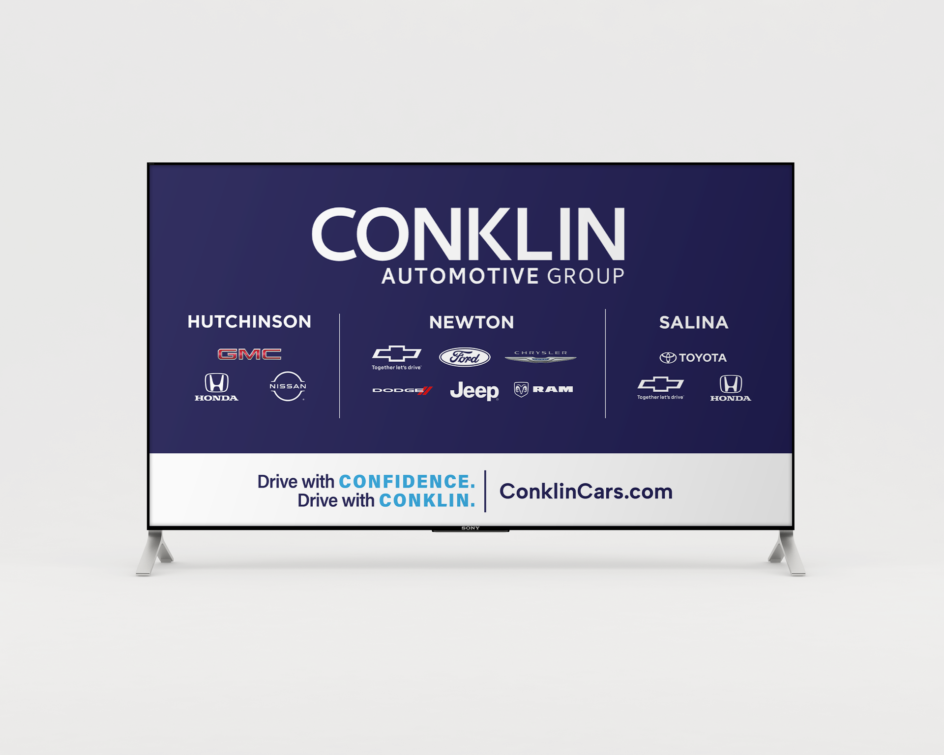 A flat screen tv with a conklin automotive group advertisement on it.