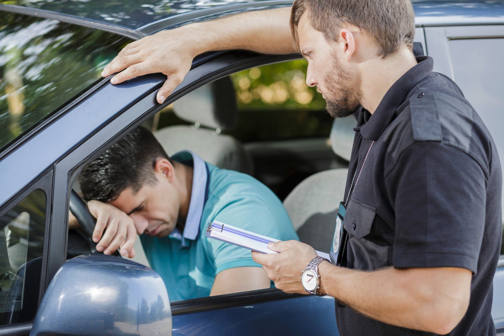 Traffic Violation - Sad Young Man in Car Fined by Police Officer in Belvidere, NJ