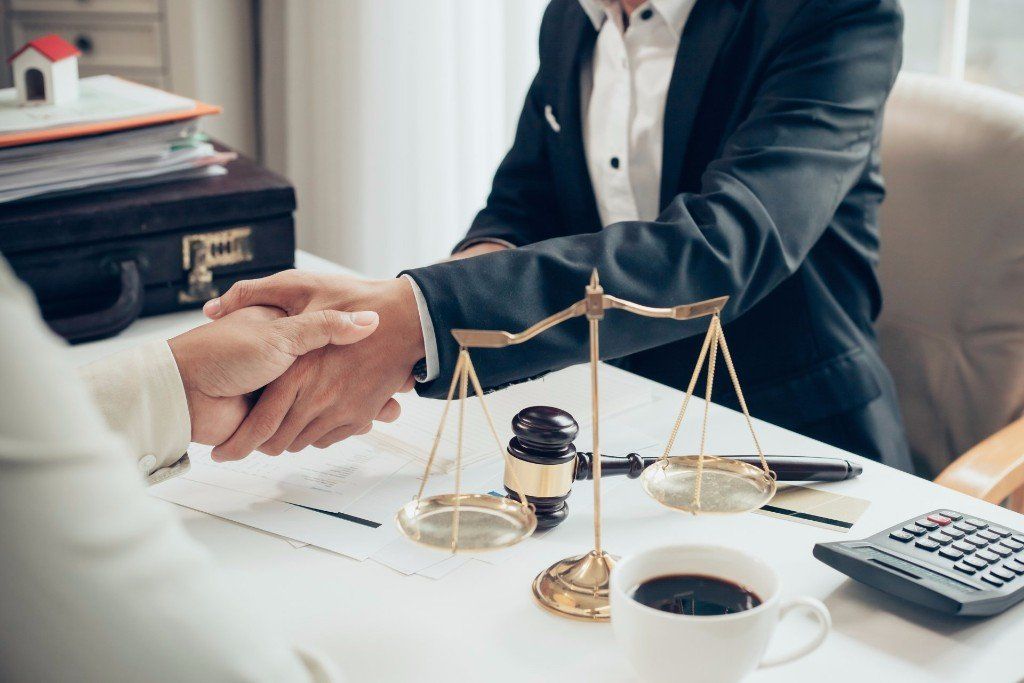 Life Assurance - Businessman Shaking Hands to Seal a Deal with His Partner Lawyers in Belvidere, NJ