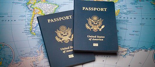 Passports on a Map of the World — Personal Injury in Dallas, TX