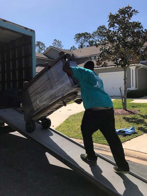 same-day Moves — Man pushing the cart inside the Truck in Jacksonville, FL