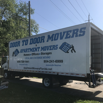 Statewide Moving — Family Carrying Boxes Into New Home On Moving Day in Jacksonville, FL